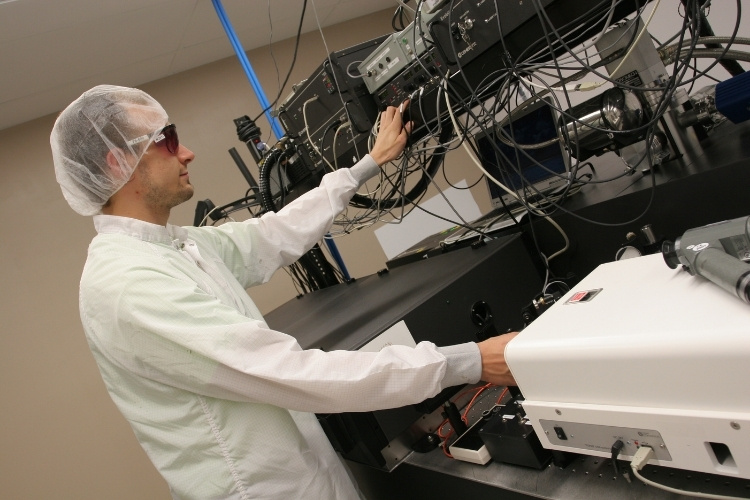 A laser scientist in a lab